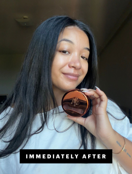 Bianca Richards holding up primer product